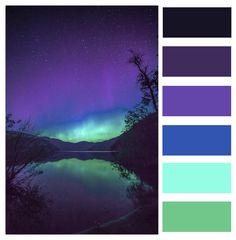 the aurora bore is reflected in water with purple and green hues, as well as blue