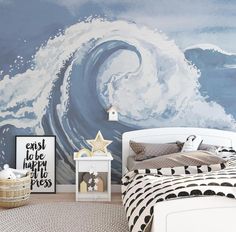 a bedroom with a large wave painted on the wall