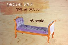 a purple couch sitting on top of a wooden floor next to a wood paneled wall