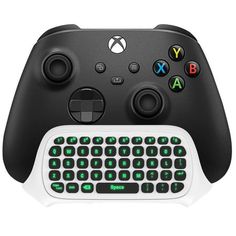 a close up of a controller and keyboard on a white surface with green letters in the middle