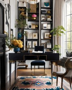 a home office with black shelving and gold accents