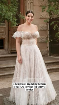 a woman in a wedding dress standing on the street smiling at the camera with her hands behind her back