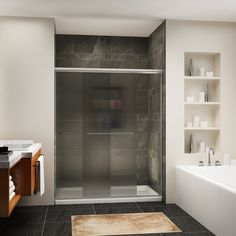 a bathroom with a walk in shower next to a bathtub and sink under a mirror