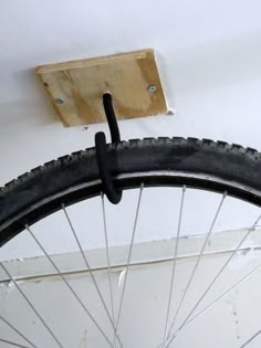 a bicycle tire is hanging on the wall