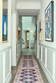 the hallway is clean and ready for guests to use it as an entrance way in this home