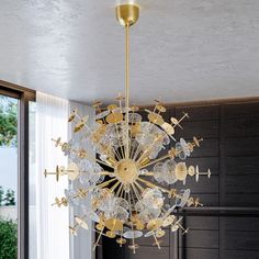 a chandelier hanging from the ceiling in a room