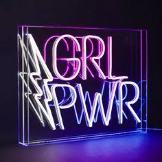 a neon sign that says girl power on the front and back of it in purple light