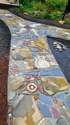 a walkway made out of stones and gravel