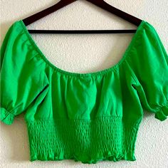 Perfect Condition. Never Worn Us 6. Elastic Smocked Waist Band And Puff Sleeves With Elastic Lining. Green Summer Blouse With Smocked Cuffs, Summer Green Blouse With Smocked Cuffs, Green Puff Sleeve Smocked Top, Trendy Green Smocked Top, Casual Cropped Smocked Top, Casual Peasant Top For Summer, Casual Green Smocked Top With Puff Sleeves, Casual Solid Smocked Top With Stretch, Green Casual Peasant Top For Vacation