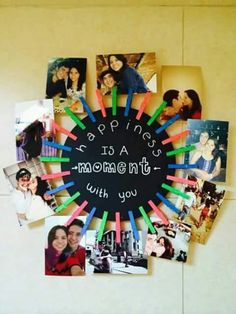 a black circle surrounded by photos and magnets with the words happiness is a moment without you written on it