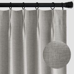 a curtain with a circle drawn on it and a black rod in the middle is shown