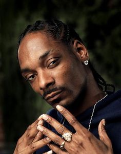 a man with dreadlocks and a ring on his finger