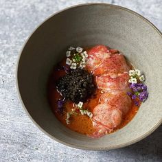 a bowl filled with food on top of a table