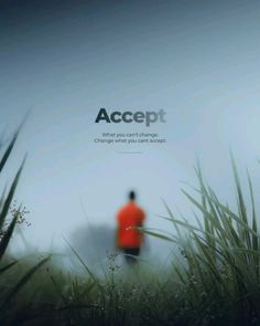 a man in an orange jacket walking through tall grass with the words accept on it