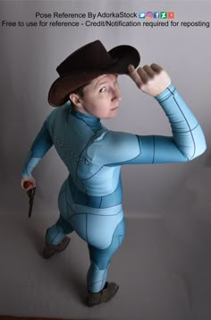 a man in a blue bodysuit and hat holding a wrench to his head