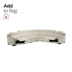 a white leather sectional sofa with black legs and arm rests on an advertise board