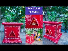 three red planters sitting next to each other on top of a wooden table in front of