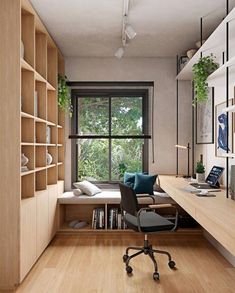 a room with a desk, chair and bookshelf next to a large window