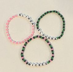 three bracelets with words written on them