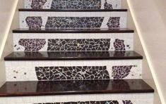 a set of stairs painted with mosaic tiles