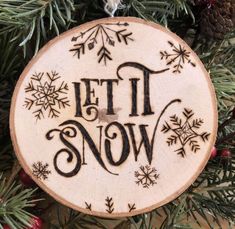 a wooden ornament with the words petti snow on it hanging from a christmas tree