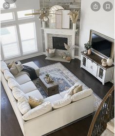 an aerial view of a living room with white furniture