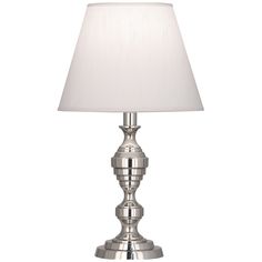 a silver table lamp with a white shade on the top and bottom part of it