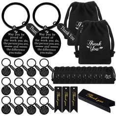 a set of six key chains with black and gold tags attached to them, along with the words thank you