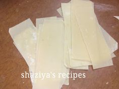 several pieces of cheese sitting on top of a wooden table with the words shazzya's recipes written below them