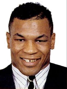 a close up of a person wearing a suit and tie with a smile on his face