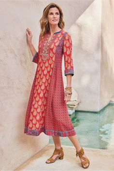 This mid-length dress has a beautiful mix of patterns to create a unique style. 3/4 length sleeves, v-neckline. Phoenix Dress, Shweshwe Dresses, Women Dress Collection, Soft Surroundings Dresses, Patterned Midi Dress, Next Dresses, Stretchy Dress, Velvet Fashion, Women's Casual Style