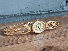 Stunning, vintage USSR Seagull watch in gold. This is one of the first watches in this style (filigree), very high quality made, rare watch. Vintage mechanical women's watch "Chaika" produced by the Uglich Watch Factory (Uglich), founded in 1942. Retro women's vintage watch, mechanical. Seagull with a beautiful dial. The watch is in excellent condition. This is an old production watch. They work well, have been serviced and checked by a professional watchmaker. The elegant Scan "Chaika" wristwatch is equipped with a 17-jewel movement. Bracelet Length: 18.5 cm (7.28 inch) This is a mechanical watch, so wind it every day. Visit my store here: https://odessa13watch.etsy.com If you have any questions for me. I will be happy to answer them. PLEASE NOTE All of our items are vintage and sold AS I Victorian Gold Watch For Formal Occasions, Victorian Engraved Gold Watches, Victorian Gold Formal Watch, Victorian Gold Watch For Weddings, Gold Victorian Watches For Weddings, Heirloom Gold Engraved Watch, Vintage Gold Watch With Round Dial, Antique Gold Watch With Skeleton Dial, Antique Gold Watches For Wedding