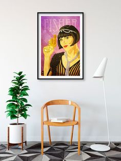 a chair and table in a room with a poster on the wall