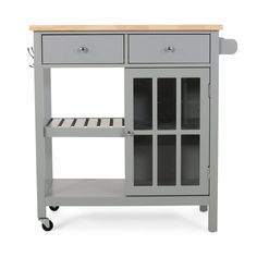 a gray kitchen cart with drawers and shelves on wheels is shown in front of a white background