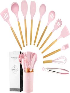 pink kitchen utensils in a cup with gold handles