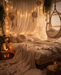 a bed with white sheets and lights hanging from the ceiling