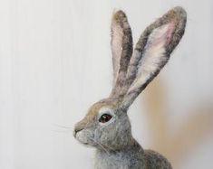 a stuffed rabbit sitting on top of a table