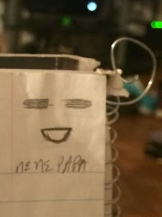 a paper bag with a face drawn on it