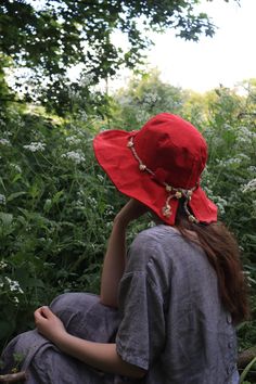 "The 'Arwen' hat is a beautiful linen sun hat perfect for long summer days in the garden and exploring nature. Made from high quality 100% natural linen in a True red colour.  The hat has French millinery wire within the brim edge to give it a perfect romantic, artisanal look, the whole look of this hat is intended to give a perfectly imperfect feel of a casual easy to wear summer hat that has a very pretty silhouette. The brim of the Arwen is also slightly A-Symmetrical thanks to the split in t Linen Fedora Hat For Spring, Bohemian Sun Hat For Spring, Bohemian Hats For Spring Outdoor, Bohemian Hats For Spring Outdoor Events, Bohemian Hats For Spring Outdoor Occasions, Linen Summer Hat For Outdoor, Summer Linen Hat For Outdoor, Bohemian Spring Outdoor Hat, Red Bohemian Straw Hat With Short Brim