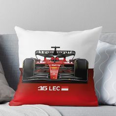 a red race car with the number 46 lec on it throw pillow