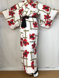 A cute vintage Yukata Kimono dress from Japan.  Made of light cotton for warm summer days.  Wear this as a dress, robe, beach cover or dressing gown.   Fits a women's size S. MATERIAL:  100% Cotton.  Unlined. PATTERN:  Oversized flowers and lattice. Color:  White with black, red & yellow design. CONDITION:  Used vintage.  A few light stains (see photos). Sash NOT included. Kimono sash sold separately. My shop: https://kimonomemoirs.etsy.com. SIZE: Women's SMALL Kimono. Wingspan- 49 inch (124.5 c Historical Kimono, White Yukata, Small Kimono, Japanese Dress Kimono, Yukata Women, Japanese Wedding Dress, Oversized Flowers, Floral Dress Long, Cute Kimonos