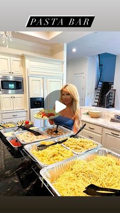 a woman is making pasta in her kitchen with the words pasta bar overlayed