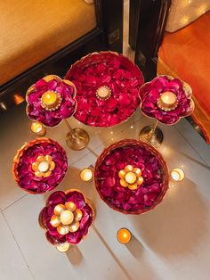 a table topped with lots of flowers and candles