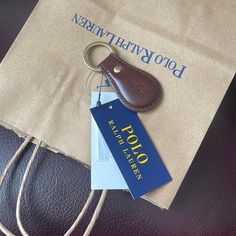 a bag with a leather keychain attached to it