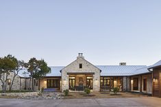 a large house with stone and wood accents