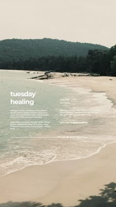 a beach with water and trees in the background that says tuesday healing