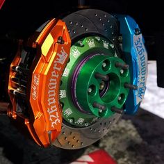 the front brakes and rotors of a motorcycle are multicolored in different colors