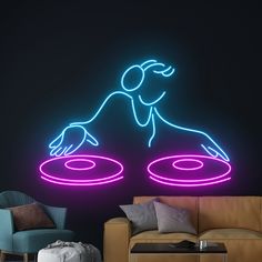 a neon sign that is on the wall next to a couch