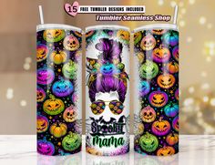 the tumbler is decorated with colorful skulls and pumpkins, as well as an image of a woman's face