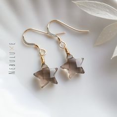 Smoky quartz star crystal earrings, April birthstone earrings, 10th Anniversary gift, Star earrings, Celestial earrings, Virgo zodiac jewelry ◦ All of the stones used in our jewelry are 100% genuine. These smoky quartz stones are expertly cut and shaped into a star ◦ Comes on your choice of 925 sterling silver or 14m gold filled ear hooks which are comfortable for all-day wear and great for sensitive ears ◦ Each stone varies in size (typically 10x10mm), shape, and color so please do expect some Star-shaped Earrings With Lever Back For Gifts, Star-shaped Crystal Earrings For Gifts, Smokey Quartz Jewelry, Smoky Quartz Earrings, 10th Anniversary Gifts, Star Crystal, Celestial Earrings, Earrings Star, Night Court